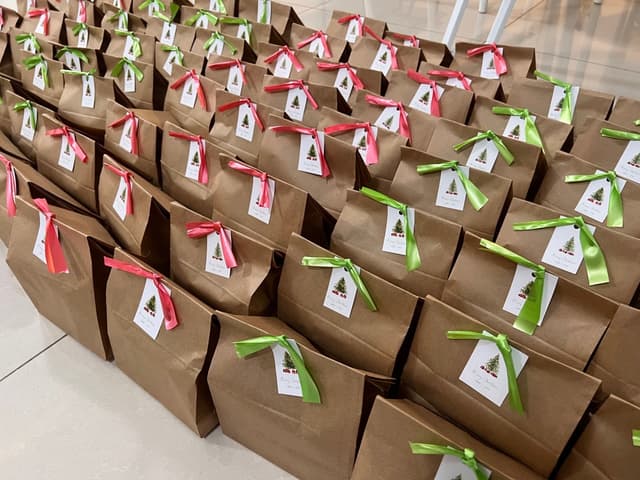 Christmas brown paper bags with red and green ribbons