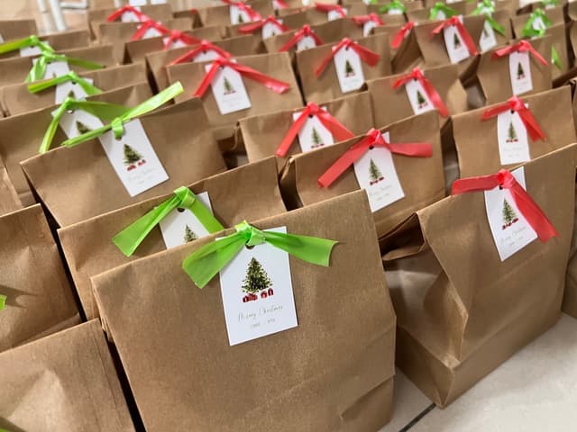 Chritmas brown paper bags with red and green ribbons