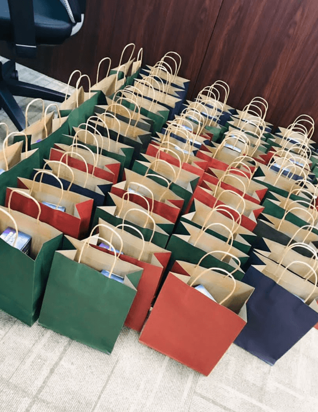 Blue, green and red paper bags on a table